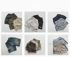 Variété de shorts pour enfants incluant styles cargo, denim et joggers en coton pour l'été