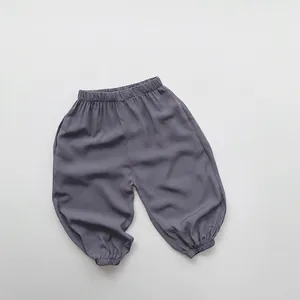 Detail of kids lightweight loose anti-mosquito pants with elastic waist and cuffed ankles