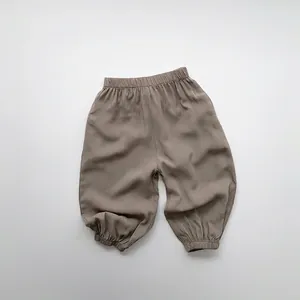 Close-up of elastic waistband and breathable fabric on children's brown mosquito pants