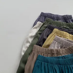 Flat lay of colorful elastic waist mosquito pants for kids in soft breathable fabric