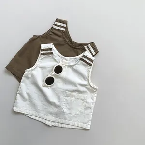 Detail view of linen-cotton kids vests in olive and beige with striped shoulders