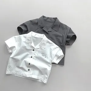 Flat lay of breathable cotton short-sleeved shirts with Café No.27 embroidery detail
