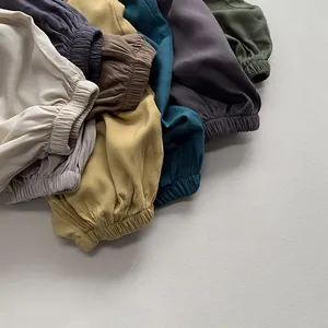 Detail of children mosquito pants showing elastic ankle cuffs in multiple soft colors