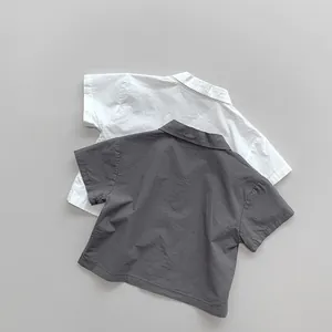 Detail of lightweight cotton linen shirts for kids showing breathable texture and lapel design