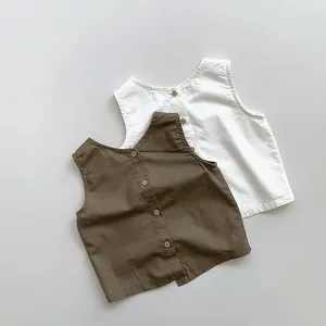 Detail view of linen blend kids vests featuring front buttons and round neck design