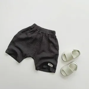Detail showing charcoal grey double-layer cotton gauze fabric texture and LOVE DREAM label