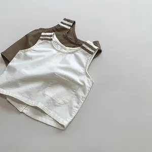 Detail of linen-cotton kids vests showing breathable fabric and woven shoulder texture