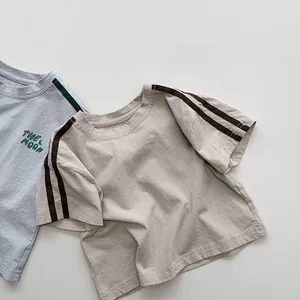 Detailed view of kids' cotton T-shirts with Moon print and striped sleeve cuffs