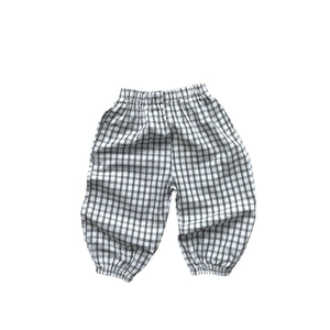 Kids black and white checkered joggers with elastic waist and cuffed hems for summer