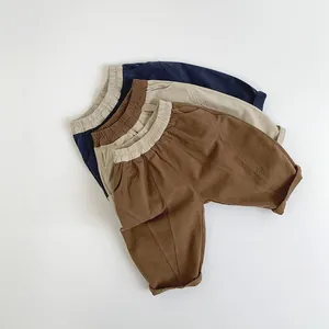 Détails de pantalons décontractés en coton pour enfants en bleu, beige et marron avec taille