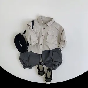 Kids stylish khaki long sleeve shirt and grey cargo pants set with black crossbody bag