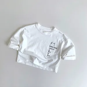 Close-up of kids white cotton tee with Grass-land letter print and coordinates