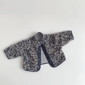 Detail of baby leopard print fleece jacket with soft blue texture and snap closures