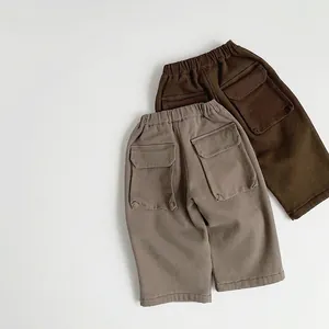 Kids thermal cargo pants in brown and dark coffee with elastic waist and large back pockets