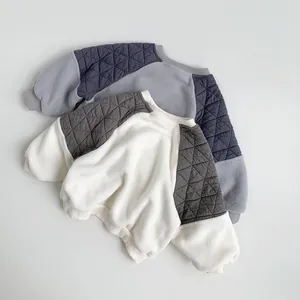 Detail of quilted shoulder stitching and fleece fabric on children long sleeve sweatshirt