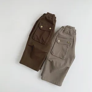 Detail of children's fleece cargo pants with elastic waist and large side pockets