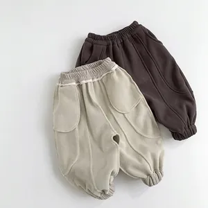 Pantalon matelassé enfant doublé polaire en beige et marron avec taille élastique