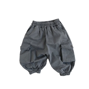 Kids cargo pants in charcoal grey with elastic waist and large side flap pockets