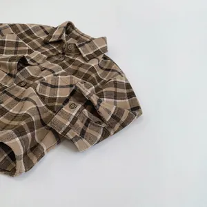 Classic vintage plaid flannel shirt for kids in brown and beige colors with buttons