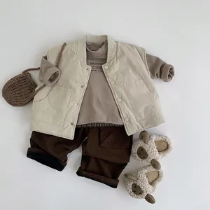 Kids warm winter outfit set featuring quilted vest, brown sweatshirt, and fleece lined trousers