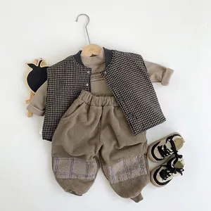 Casual winter kids outfit set with check vest, khaki top, and fleece trousers