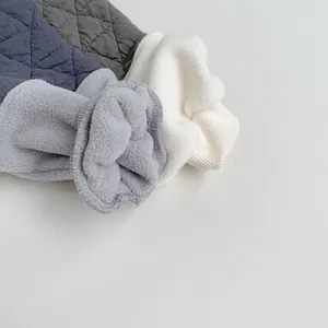 Detail of diamond quilted cuffs with thick fleece lining and ribbed elastic endings