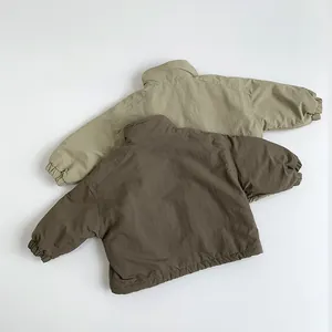 Detail of olive green and dark brown children's warm fleece jackets with elastic cuffs