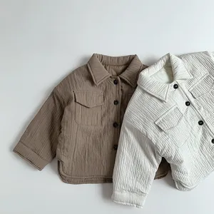 Close-up of quilted children's shirt jacket featuring vertical texture and chest pockets