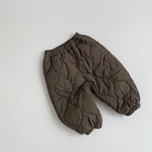 Detailed view of kids quilted cotton pants with gourd pattern and elastic cuffs