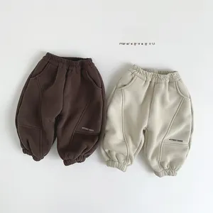 Detail view of thickened winter joggers with elastic waist and Study Hard print