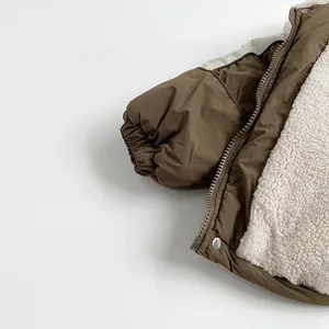 Close-up of olive green children's winter jacket with thick white sherpa fleece lining