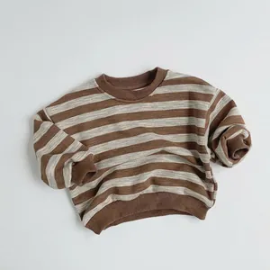 Detail of warm striped fleece sweatshirt for kids with ribbed cuffs and crew neck