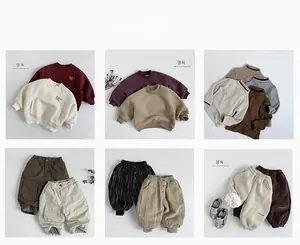 Flat lay grid of kids' winter outfits in earthy tones with soft knit and cotton textures