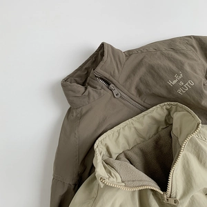 Kids lightweight fleece-lined zip jackets in olive and sage green with Pluto embroidery