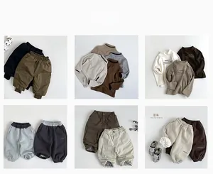 Camicie in piumino invernali per bambini e maglie a nido d'ape con pantaloni cargo