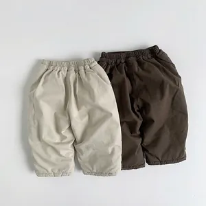 Thick warm winter padded kids trousers in beige and dark brown minimalist style
