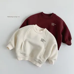 Detail of fleece-lined sweatshirts with Nature Wilderness print and ribbed cuffs