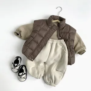 Kids winter thermal clothing set with brown quilted vest and khaki fleece sweatshirt