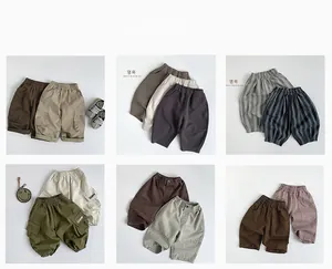Collage of kids cotton cargo shorts in various neutral colors with elastic waistbands