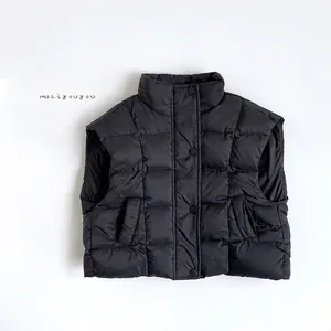 Detail view of black quilted down vest featuring a stand collar and snap button closure