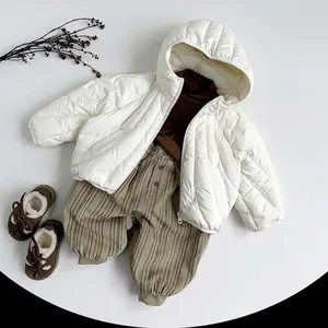 Quilted winter jacket with corduroy pants and warm boots for children in autumn colors