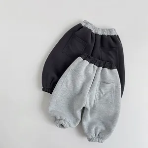 Kids warm fleece joggers featuring contrast waistbands and back pockets in gray tones