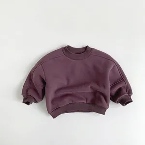 Flat lay of thick purple cotton fleece sweatshirt for kids with ribbed cuffs and neck