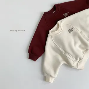 Detail of ribbed cuffs and collar on kids fleece sweatshirt with Nature print