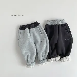 Detail of fleece lining and 'BEST DREAM' print on kids' thick winter sweatpants