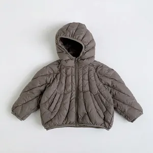 Close-up of kids coffee brown down jacket with radial stitching and resin zipper