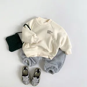 Kids warm fleece sweatshirt and jogger set in cream and grey for winter season