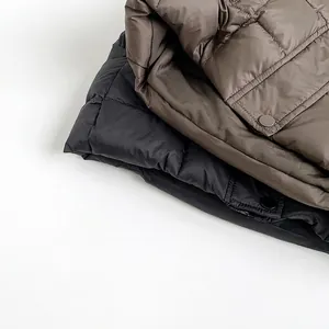 Quilted kids down vest in black and coffee colors with snap buttons and soft lining