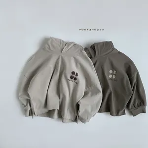 Detail view of cotton hoodie fabric with everything lucky print and ribbed cuffs