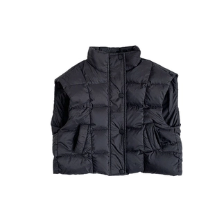 Kids black quilted down vest with stand collar and button closure for winter warmth